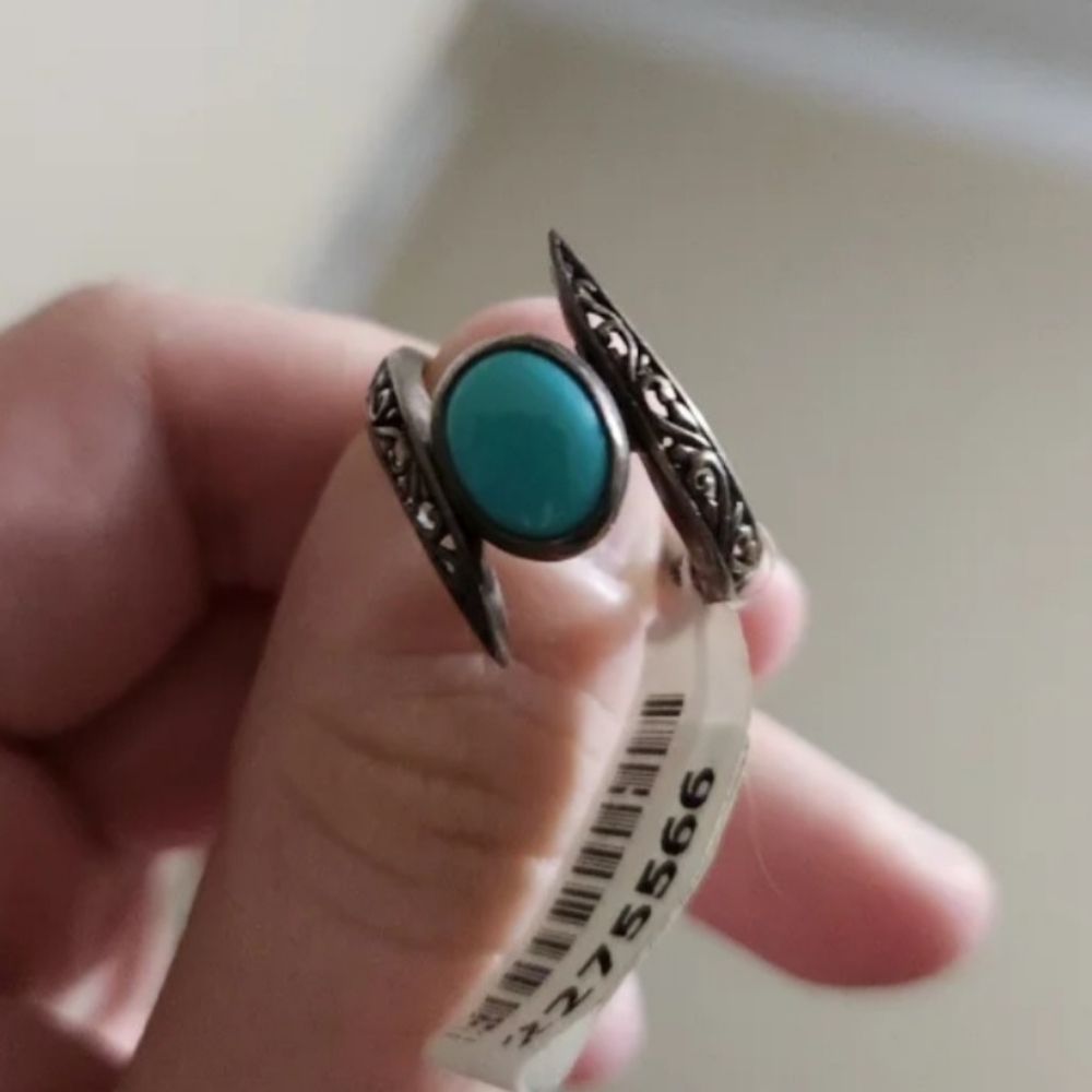 Ring with blue stone.